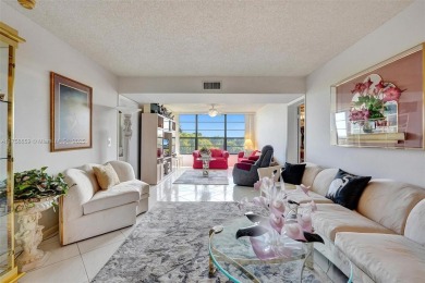 This 2 bedroom 2 bathroom 4th floor condo overlooking the golf on Pine Island Ridge Country Club in Florida - for sale on GolfHomes.com, golf home, golf lot