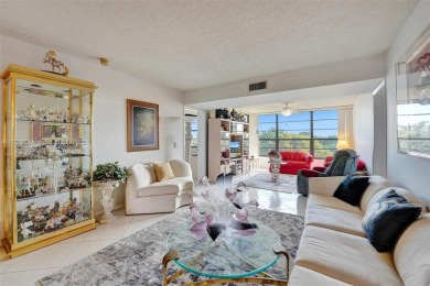 This 2 bedroom 2 bathroom 4th floor condo overlooking the golf on Pine Island Ridge Country Club in Florida - for sale on GolfHomes.com, golf home, golf lot