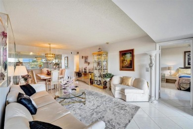 This 2 bedroom 2 bathroom 4th floor condo overlooking the golf on Pine Island Ridge Country Club in Florida - for sale on GolfHomes.com, golf home, golf lot