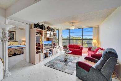 This 2 bedroom 2 bathroom 4th floor condo overlooking the golf on Pine Island Ridge Country Club in Florida - for sale on GolfHomes.com, golf home, golf lot