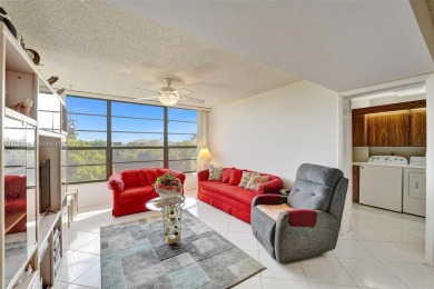 This 2 bedroom 2 bathroom 4th floor condo overlooking the golf on Pine Island Ridge Country Club in Florida - for sale on GolfHomes.com, golf home, golf lot