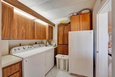 This 2 bedroom 2 bathroom 4th floor condo overlooking the golf on Pine Island Ridge Country Club in Florida - for sale on GolfHomes.com, golf home, golf lot