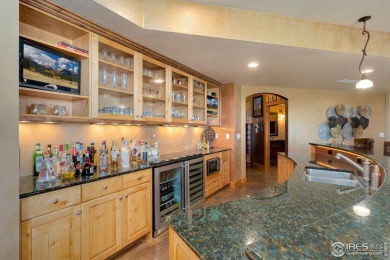 Located in Highland Hills, this exquisite property is nestled on Ptarmigan Golf Course in Colorado - for sale on GolfHomes.com, golf home, golf lot