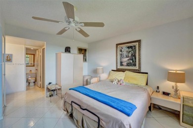 This 2 bedroom 2 bathroom 4th floor condo overlooking the golf on Pine Island Ridge Country Club in Florida - for sale on GolfHomes.com, golf home, golf lot