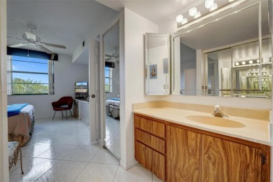 This 2 bedroom 2 bathroom 4th floor condo overlooking the golf on Pine Island Ridge Country Club in Florida - for sale on GolfHomes.com, golf home, golf lot