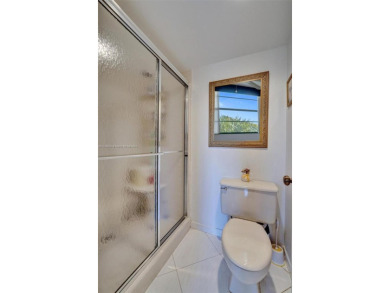 This 2 bedroom 2 bathroom 4th floor condo overlooking the golf on Pine Island Ridge Country Club in Florida - for sale on GolfHomes.com, golf home, golf lot