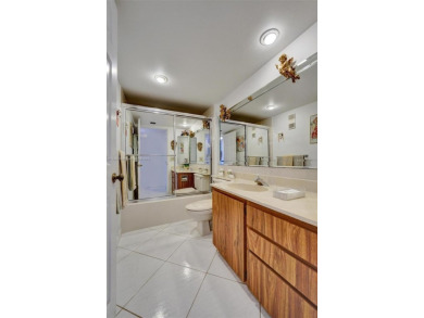 This 2 bedroom 2 bathroom 4th floor condo overlooking the golf on Pine Island Ridge Country Club in Florida - for sale on GolfHomes.com, golf home, golf lot