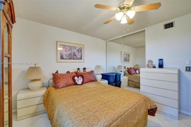 This 2 bedroom 2 bathroom 4th floor condo overlooking the golf on Pine Island Ridge Country Club in Florida - for sale on GolfHomes.com, golf home, golf lot
