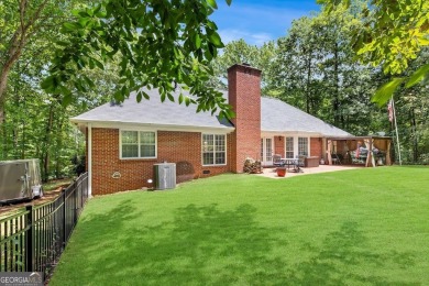 Discover this well-maintained, four-sided brick ranch perfectly on Fairfield Plantation Golf and Country Club in Georgia - for sale on GolfHomes.com, golf home, golf lot