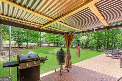 Discover this well-maintained, four-sided brick ranch perfectly on Fairfield Plantation Golf and Country Club in Georgia - for sale on GolfHomes.com, golf home, golf lot