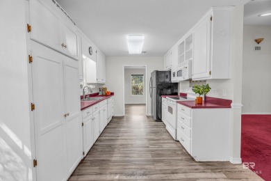There's a rhythm to life in Lake Forest that locals know by on Lake Forest Yacht and Country Club in Alabama - for sale on GolfHomes.com, golf home, golf lot