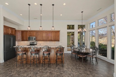 Set along the Sunbrook Golf Course, this elegant 3-bedroom on Sunbrook Golf Course in Utah - for sale on GolfHomes.com, golf home, golf lot