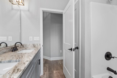 Welcome to a home that truly has it all--modern comfort on The Lakes Country Club in North Carolina - for sale on GolfHomes.com, golf home, golf lot