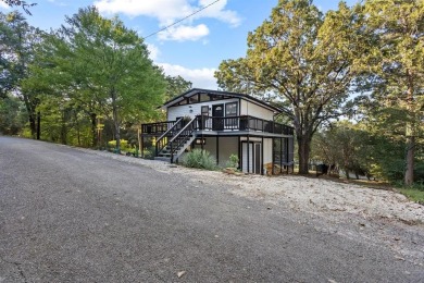 Discover your dream getaway at this idyllic lakehouse nestled in on Tanglewood Resort in Texas - for sale on GolfHomes.com, golf home, golf lot