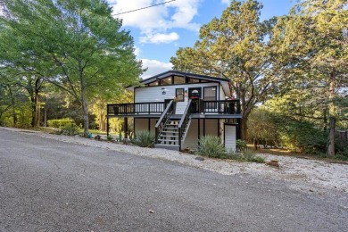 Discover your dream getaway at this idyllic lakehouse nestled in on Tanglewood Resort in Texas - for sale on GolfHomes.com, golf home, golf lot