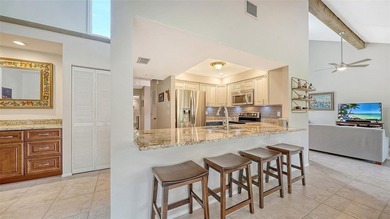 Move-in ready! Updated maintenance-free villa with serene pond on The Meadows Golf and Country Club in Florida - for sale on GolfHomes.com, golf home, golf lot