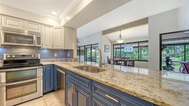 Move-in ready! Updated maintenance-free villa with serene pond on The Meadows Golf and Country Club in Florida - for sale on GolfHomes.com, golf home, golf lot