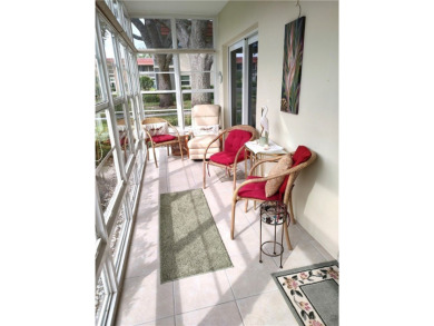 Resort style living here in beautifully remodeled 1st floor home on The American Golf Club in Florida - for sale on GolfHomes.com, golf home, golf lot