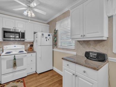 Resort style living here in beautifully remodeled 1st floor home on The American Golf Club in Florida - for sale on GolfHomes.com, golf home, golf lot
