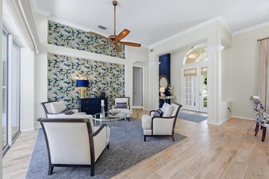 Step into a stunning, light-filled residence where elegance on University Park Country Club in Florida - for sale on GolfHomes.com, golf home, golf lot