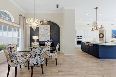 Step into a stunning, light-filled residence where elegance on University Park Country Club in Florida - for sale on GolfHomes.com, golf home, golf lot