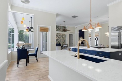 Step into a stunning, light-filled residence where elegance on University Park Country Club in Florida - for sale on GolfHomes.com, golf home, golf lot