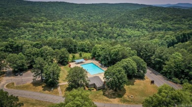 This stunning, updated studio is tucked away among the trees on on Mountain Ranch Golf Club in Arkansas - for sale on GolfHomes.com, golf home, golf lot