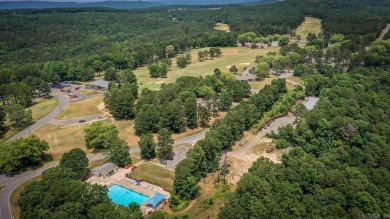 This stunning, updated studio is tucked away among the trees on on Mountain Ranch Golf Club in Arkansas - for sale on GolfHomes.com, golf home, golf lot