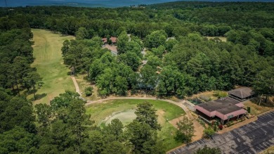 This stunning, updated studio is tucked away among the trees on on Mountain Ranch Golf Club in Arkansas - for sale on GolfHomes.com, golf home, golf lot