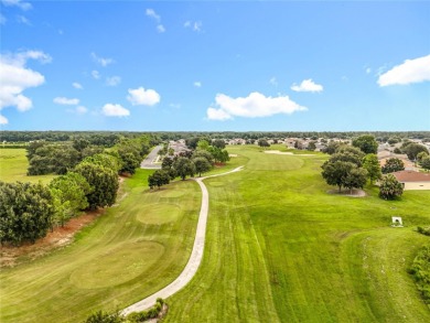 Welcome to this stunning 3-bedroom, 2-bath residence nestled in on Arlington Ridge Golf Club in Florida - for sale on GolfHomes.com, golf home, golf lot