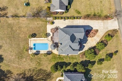 Experience luxury and privacy on over an acre in Mooresville's on Mallard Head Country Club in North Carolina - for sale on GolfHomes.com, golf home, golf lot