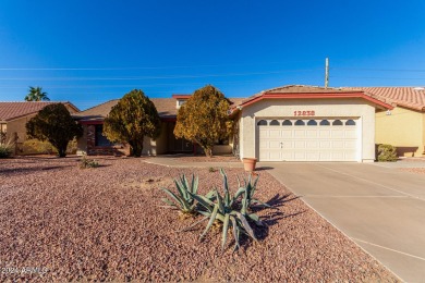 Experience the ultimate lock-and-leave lifestyle in this on The Lakes at Ahwatukee in Arizona - for sale on GolfHomes.com, golf home, golf lot