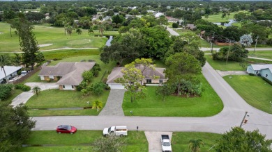 Nice family home on a corner lot that backs up to the golf on Island Pines Golf Club in Florida - for sale on GolfHomes.com, golf home, golf lot