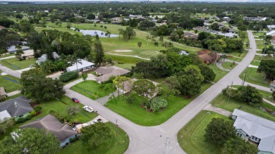 Nice family home on a corner lot that backs up to the golf on Island Pines Golf Club in Florida - for sale on GolfHomes.com, golf home, golf lot