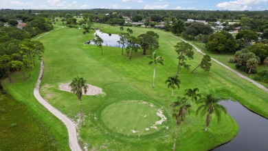 Nice family home on a corner lot that backs up to the golf on Island Pines Golf Club in Florida - for sale on GolfHomes.com, golf home, golf lot