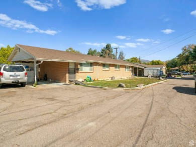 Three Side by Side brick duplexes, totaling 6 units on .50 acres on Nibley Park Golf Course in Utah - for sale on GolfHomes.com, golf home, golf lot