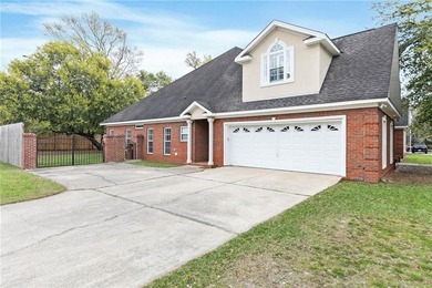 Custom-built home in the established Llanfair subdivision on Spring Hill College Golf Course in Alabama - for sale on GolfHomes.com, golf home, golf lot