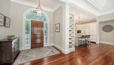 Experience the charm of this original Bo MacEwen-designed home on The Oaks Club in Florida - for sale on GolfHomes.com, golf home, golf lot