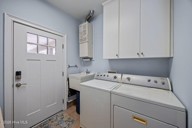 Discover refined coastal living in this exceptional Bosher's on Sound Golf Links at Albemarle Plantation in North Carolina - for sale on GolfHomes.com, golf home, golf lot