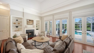 Experience the charm of this original Bo MacEwen-designed home on The Oaks Club in Florida - for sale on GolfHomes.com, golf home, golf lot