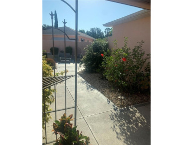 Welcome Home to this charming courtyard in the Village of De La on Tierra Del Sol Golf and Country Club in Florida - for sale on GolfHomes.com, golf home, golf lot