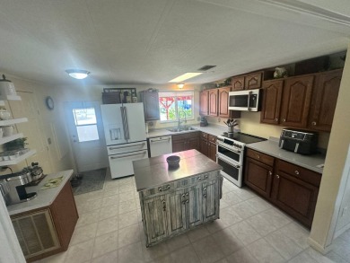 Lot Rent is $1342.00 monthly  Another showcase home in the on Del Tura Golf and Country Club in Florida - for sale on GolfHomes.com, golf home, golf lot