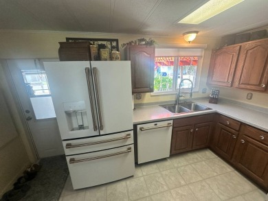 Lot Rent is $1342.00 monthly  Another showcase home in the on Del Tura Golf and Country Club in Florida - for sale on GolfHomes.com, golf home, golf lot