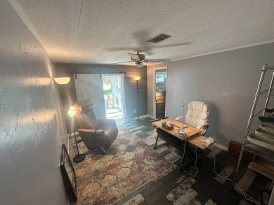 Lot Rent is $1342.00 monthly  Another showcase home in the on Del Tura Golf and Country Club in Florida - for sale on GolfHomes.com, golf home, golf lot