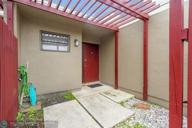 Welcome to this exceptional corner townhouse in the heart of on Pembroke Lakes Golf Club in Florida - for sale on GolfHomes.com, golf home, golf lot