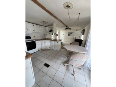 Charming 2-bedroom home in highly sought after Hidden Golf on Lake Henry Golf Club in Florida - for sale on GolfHomes.com, golf home, golf lot