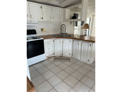 Charming 2-bedroom home in highly sought after Hidden Golf on Lake Henry Golf Club in Florida - for sale on GolfHomes.com, golf home, golf lot