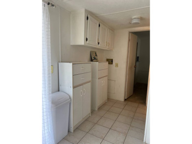 Charming 2-bedroom home in highly sought after Hidden Golf on Lake Henry Golf Club in Florida - for sale on GolfHomes.com, golf home, golf lot
