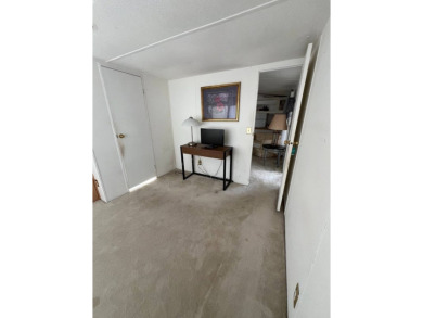 Charming 2-bedroom home in highly sought after Hidden Golf on Lake Henry Golf Club in Florida - for sale on GolfHomes.com, golf home, golf lot