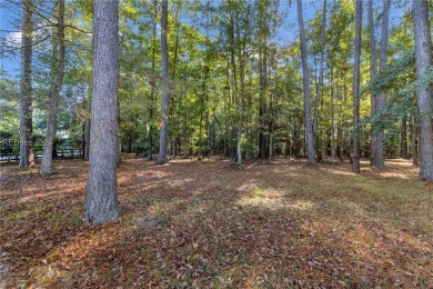 Design your dream home on this spacious corner wooded lot in the on Berkeley Hall Golf Club in South Carolina - for sale on GolfHomes.com, golf home, golf lot